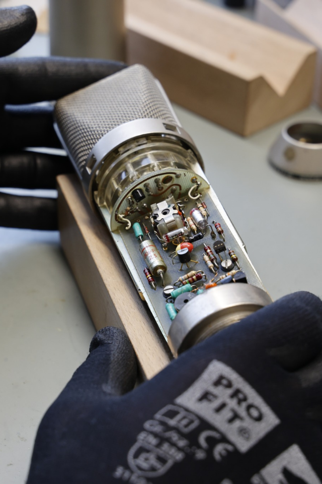 How does the Neumann microphone warranty process usually work?